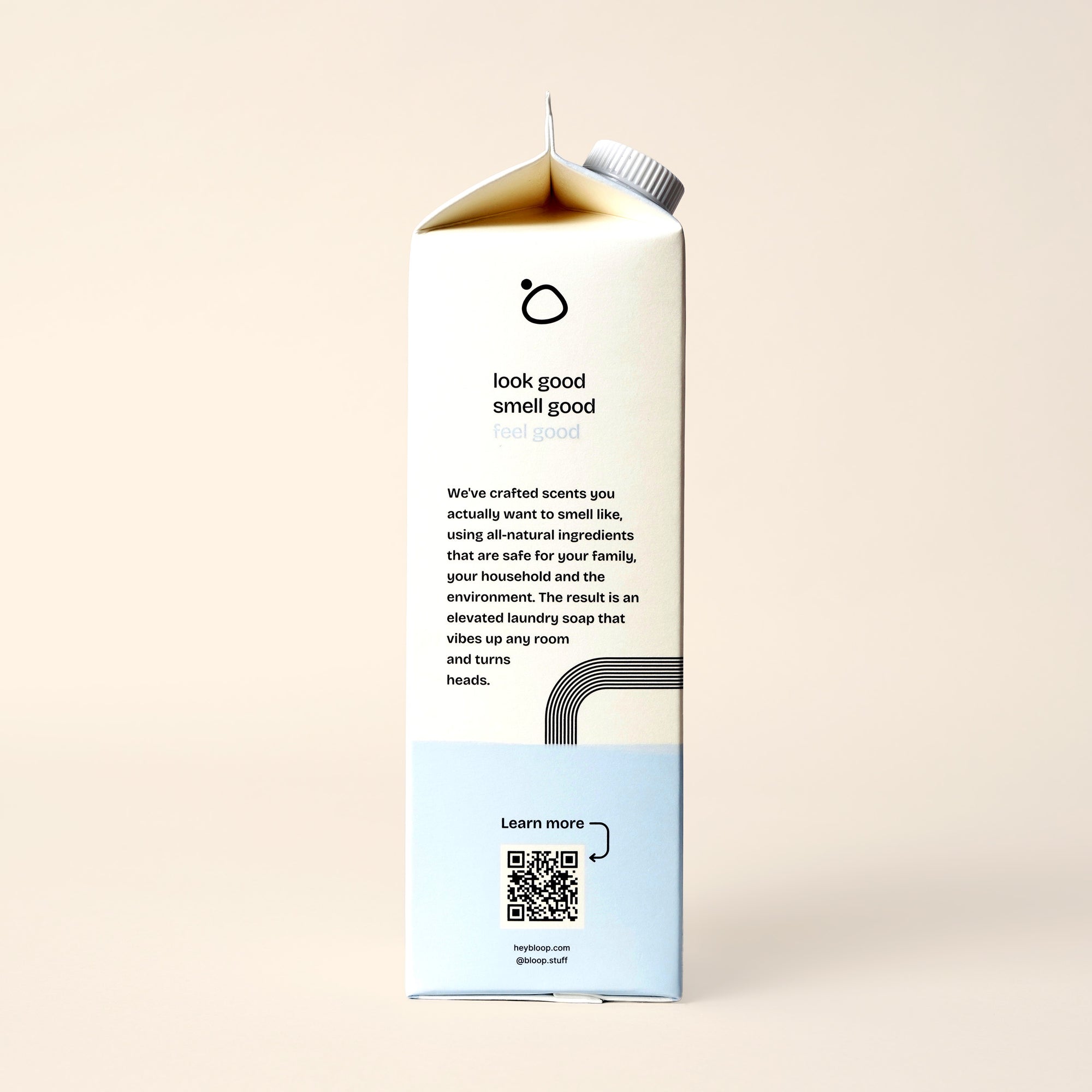 Side View of Care Free Concentrated Laundry Soap. 32 ounces, plastic-free. Information about Bloop's mission with QR code.