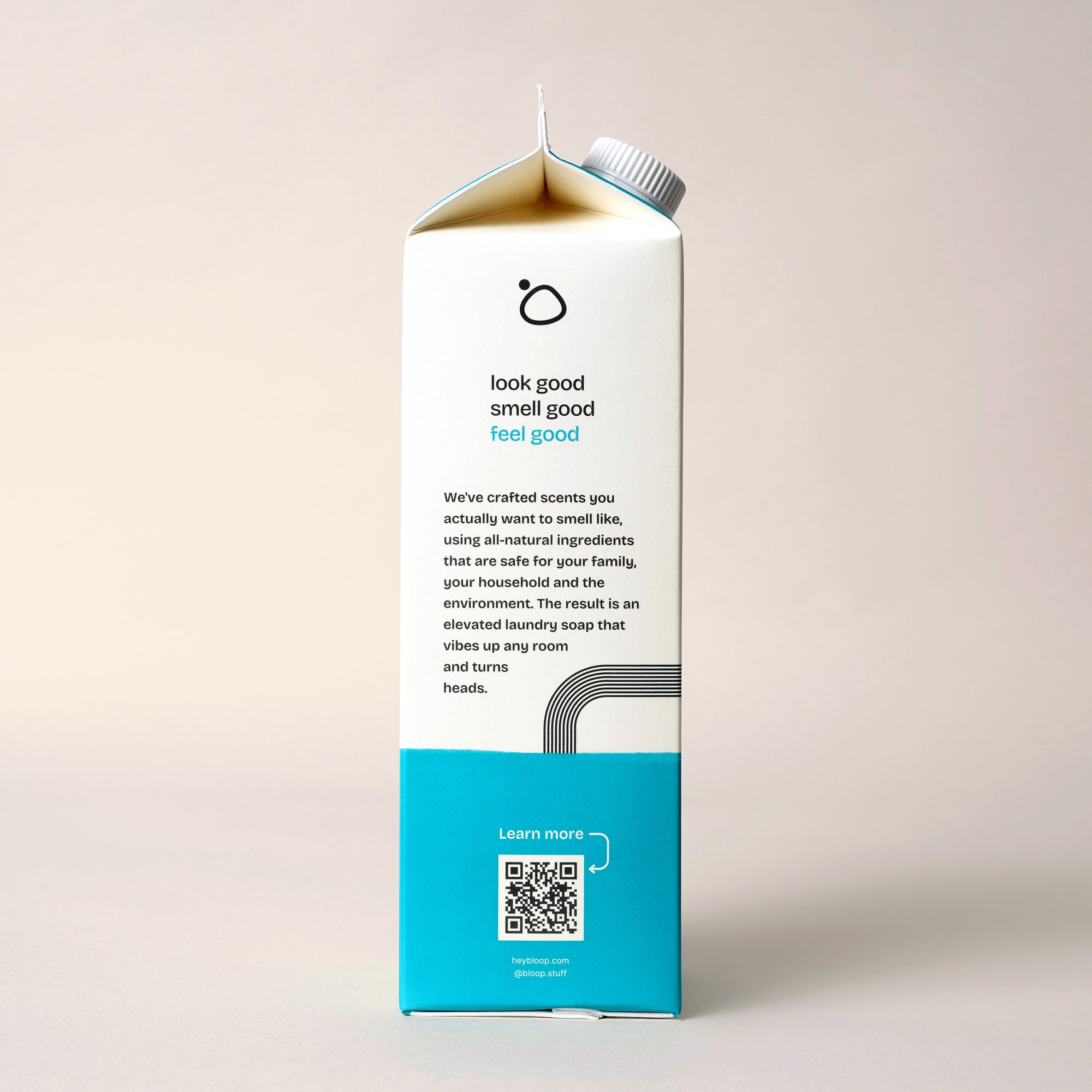 Side View of Salt Air Concentrated Laundry Soap. 32 ounces, plastic-free. Information about Bloop's mission with QR code.