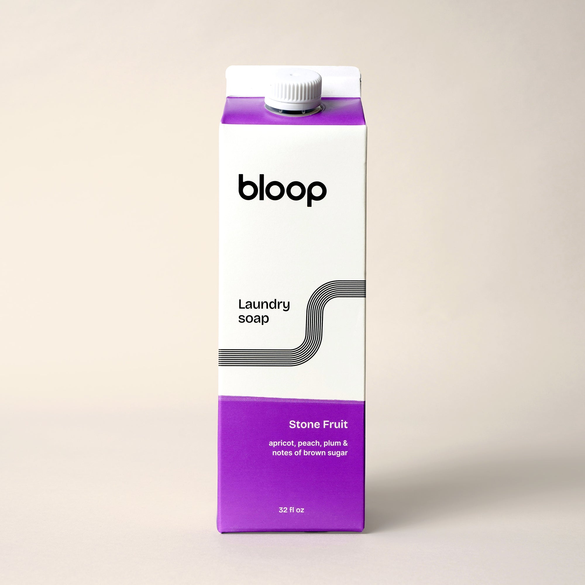 Front View of Stone Fruit Natural Laundry Soap. 32 ounces, plastic-free packaging.