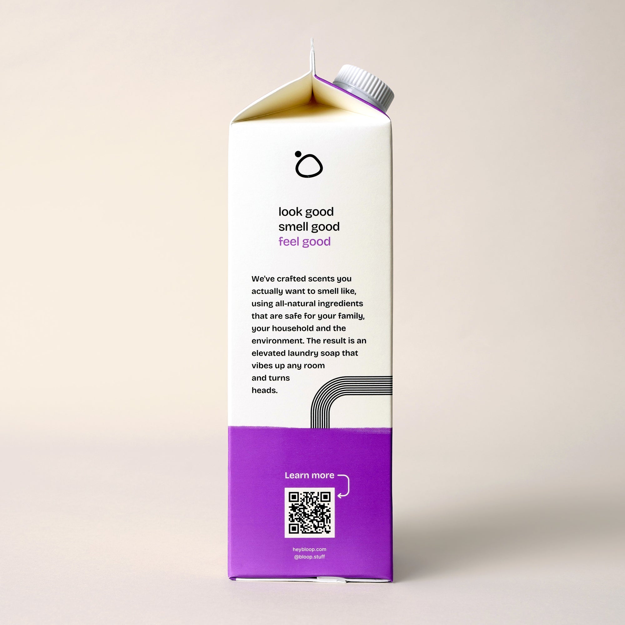 Side View of Stone Fruit Concentrated Laundry Soap. 32 ounces, plastic-free. Information about Bloop's mission with QR code.