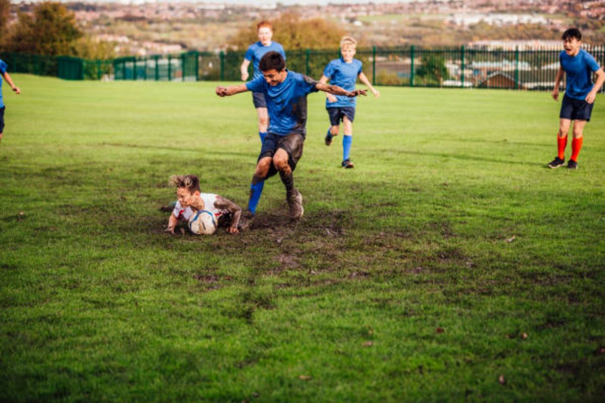 Playing soccer in the mud