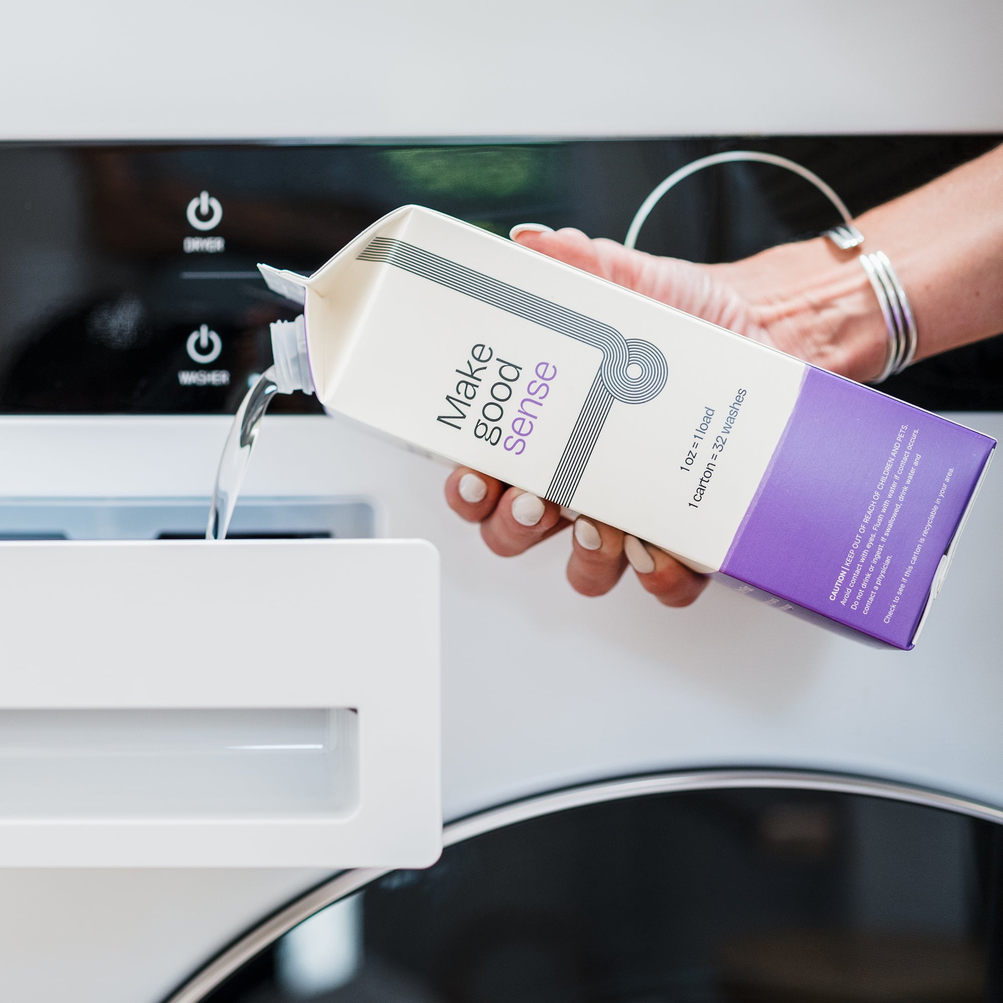 Side View of Stone Fruit Laundry Soap. 32 ounces. Plastic-free packaging. Laundry Soap being poured into washing machine. 